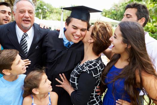 Student and his family celebrating graduation